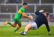 25 September 2022; Ruairí McNamee of Rhode gets past the tackle of Tullamore goalkeeper Corey White on his way to scoring his side's first goal during the Offaly County Senior Football Championship Final match between Tullamore and Rhode at O'Connor Park in Tullamore, Offaly. Photo by Ben McShane/Sportsfile
