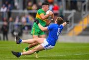 25 September 2022; Ruairí McNamee of Rhode gets past the tackle of Johnny Moloney of Tullamore on his way to scoring his side's first goal during the Offaly County Senior Football Championship Final match between Tullamore and Rhode at O'Connor Park in Tullamore, Offaly. Photo by Ben McShane/Sportsfile