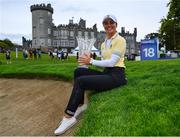 25 September 2022; Klara Spilkova of Czech Republic celebrates with the trophy in front of Dromoland Castle after winning on the first play-off hole during round four of the KPMG Women's Irish Open Golf Championship at Dromoland Castle in Clare. Photo by Brendan Moran/Sportsfile