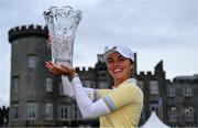 25 September 2022; Klara Spilkova of Czech Republic celebrates with the trophy in front of Dromoland Castle after winning on the first play-off hole during round four of the KPMG Women's Irish Open Golf Championship at Dromoland Castle in Clare. Photo by Brendan Moran/Sportsfile