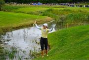 25 September 2022; Klara Spilkova of Czech Republic reacts to the applause from the gallery after chipping out of a water hazard at the 17th green during round four of the KPMG Women's Irish Open Golf Championship at Dromoland Castle in Clare. Photo by Brendan Moran/Sportsfile