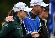 25 September 2022; Leona Maguire of Ireland leaves the course with her caddie Dermot Byrne after finishing her round during round four of the KPMG Women's Irish Open Golf Championship at Dromoland Castle in Clare. Photo by Brendan Moran/Sportsfile