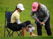 25 September 2022; Klara Spilkova of Czech Republic dries her feet with a towel after playing from a water hazard on the 17th green during round four of the KPMG Women's Irish Open Golf Championship at Dromoland Castle in Clare. Photo by Brendan Moran/Sportsfile