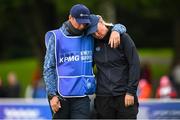 25 September 2022; Nicole Broch Estrup of Denmark is consoled by her caddie and husband Kasper Estrup after missing a putt for outright victory on the 18th green during round four of the KPMG Women's Irish Open Golf Championship at Dromoland Castle in Clare. Photo by Brendan Moran/Sportsfile