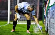 22 September 2022; Shamrock Rovers goalkeeer Alan Mannus removes a flare from the pitch during the SSE Airtricity League Premier Division match between Shelbourne and Shamrock Rovers at Tolka Park in Dublin. Photo by Sam Barnes/Sportsfile