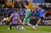 26 September 2022; Neil Farrugia of Shamrock Rovers has a shot on goal, despite the attention of Evan Osam of UCD, saved by UCD goalkeeper Kian Moore during the SSE Airtricity League Premier Division match between Shamrock Rovers and UCD at Tallaght Stadium in Dublin. Photo by Ben McShane/Sportsfile