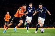 24 September 2022; Matt Doherty of Republic of Ireland in action against Greg Taylor, right, and Ryan Christie of Scotland during UEFA Nations League B Group 1 match between Scotland and Republic of Ireland at Hampden Park in Glasgow, Scotland. Photo by Stephen McCarthy/Sportsfile