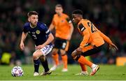 24 September 2022; Greg Taylor of Scotland in action against Chiedozie Ogbene of Republic of Ireland during UEFA Nations League B Group 1 match between Scotland and Republic of Ireland at Hampden Park in Glasgow, Scotland. Photo by Stephen McCarthy/Sportsfile