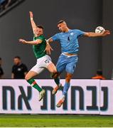 27 September 2022; Andy Lyons of Republic of Ireland in action against Roi Herman of Israel during the UEFA European U21 Championship play-off second leg match between Israel and Republic of Ireland at Bloomfield Stadium in Tel Aviv, Israel. Photo by Seb Daly/Sportsfile