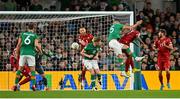 27 September 2022; John Egan of Republic of Ireland heads his side's first goal during the UEFA Nations League B Group 1 match between Republic of Ireland and Armenia at Aviva Stadium in Dublin. Photo by Ramsey Cardy/Sportsfile