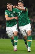 27 September 2022; John Egan of Republic of Ireland celebrates with team-mate Jason Knight, left, after scoring their side's first goal during the UEFA Nations League B Group 1 match between Republic of Ireland and Armenia at Aviva Stadium in Dublin. Photo by Eóin Noonan/Sportsfile