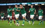 27 September 2022; John Egan, 5, of Republic of Ireland celebrates with team-mates Jason Knight, 17, and Michael Obafemi, left, after scoring their side first goal during the UEFA Nations League B Group 1 match between Republic of Ireland and Armenia at Aviva Stadium in Dublin. Photo by Eóin Noonan/Sportsfile