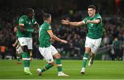 27 September 2022; John Egan of Republic of Ireland celebrates with Jason Knight, centre, and Michael Obafemi, left, after scoring their side's first goal during the UEFA Nations League B Group 1 match between Republic of Ireland and Armenia at Aviva Stadium in Dublin. Photo by Eóin Noonan/Sportsfile