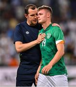 27 September 2022; Evan Ferguson of Republic of Ireland is consoled by assistant manager John O'Shea after the UEFA European U21 Championship play-off second leg match between Israel and Republic of Ireland at Bloomfield Stadium in Tel Aviv, Israel. Photo by Seb Daly/Sportsfile
