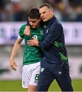 27 September 2022; Dawson Devoy of Republic of Ireland is consoled by manager Jim Crawford after the UEFA European U21 Championship play-off second leg match between Israel and Republic of Ireland at Bloomfield Stadium in Tel Aviv, Israel. Photo by Seb Daly/Sportsfile