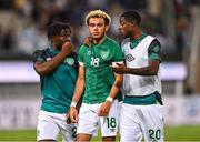 27 September 2022; Tyreik Wright of Republic of Ireland, centre, is consoled by teammates Festy Ebosele, left, and Ademipo Odubeko after the UEFA European U21 Championship play-off second leg match between Israel and Republic of Ireland at Bloomfield Stadium in Tel Aviv, Israel. Photo by Seb Daly/Sportsfile