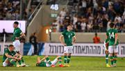27 September 2022; Dawson Devoy of Republic of Ireland and teammates after their side's defeat in a penalty shoot out during the UEFA European U21 Championship play-off second leg match between Israel and Republic of Ireland at Bloomfield Stadium in Tel Aviv, Israel. Photo by Seb Daly/Sportsfile