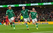 27 September 2022; Robbie Brady of Republic of Ireland celebrates with team-mates Callum Robinson, left, and Alan Browne, right, after scoring his side's third goal, a penalty, during the UEFA Nations League B Group 1 match between Republic of Ireland and Armenia at Aviva Stadium in Dublin. Photo by Ramsey Cardy/Sportsfile