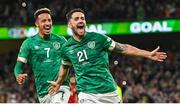 27 September 2022; Robbie Brady of Republic of Ireland celebrates after scoring his side's third goal with team-mate Callum Robinson, left, during the UEFA Nations League B Group 1 match between Republic of Ireland and Armenia at Aviva Stadium in Dublin. Photo by Ramsey Cardy/Sportsfile