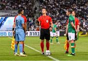 27 September 2022; Referee Nathan Verboomen with team captains Conor Coventry of Republic of Ireland, right, and Gil Cohen of Israel before the UEFA European U21 Championship play-off second leg match between Israel and Republic of Ireland at Bloomfield Stadium in Tel Aviv, Israel. Photo by Seb Daly/Sportsfile