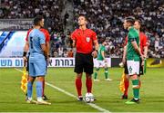 27 September 2022; Referee Nathan Verboomen with team captains Conor Coventry of Republic of Ireland, right, and Gil Cohen of Israel before the UEFA European U21 Championship play-off second leg match between Israel and Republic of Ireland at Bloomfield Stadium in Tel Aviv, Israel. Photo by Seb Daly/Sportsfile