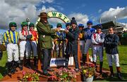 28 September 2022; Team captain's Willie Mullins and Frankie Dettori with the Barney Curley Charity Cup and their jockey's at Bellewstown Racecourse in Meath. Photo by Harry Murphy/Sportsfile