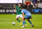 27 September 2022; Dawson Devoy of Republic of Ireland in action against Hisham Layous of Israel during the UEFA European U21 Championship play-off second leg match between Israel and Republic of Ireland at Bloomfield Stadium in Tel Aviv, Israel. Photo by Seb Daly/Sportsfile