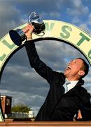 28 September 2022; Winning captain Frankie Dettori celebrates with the trophy after winning the Barney Curley Charity Cup at Bellewstown Racecourse in Meath. Photo by Harry Murphy/Sportsfile