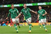 27 September 2022; Robbie Brady of Republic of Ireland celebrates after scoring his side's third goal with teammates Callum Robinson, left, and Alan Browne, during the UEFA Nations League B Group 1 match between Republic of Ireland and Armenia at Aviva Stadium in Dublin. Photo by Ramsey Cardy/Sportsfile