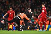 27 September 2022; A pitch invader is tackled by a Steward during the UEFA Nations League B Group 1 match between Republic of Ireland and Armenia at Aviva Stadium in Dublin. Photo by Ben McShane/Sportsfile