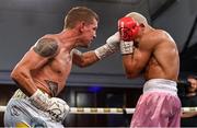 24 September 2022; Eric Donovan, left, and Khalil El Hadri during their EBU European Union super-featherweight bout at the Europa Hotel in Belfast. Photo by Ramsey Cardy/Sportsfile