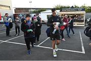 30 September 2022; Jonathan Sexton of Leinster signs an autograph for Ryan McLaughlin, age 12, from Ballymoney before the United Rugby Championship match between Ulster and Leinster at Kingspan Stadium in Belfast. Photo by David Fitzgerald/Sportsfile