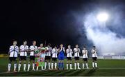 30 September 2022; Dundalk players including Greg Sloggett, third from left, and John Mountney with a banner designed by children from the Dundalk Redeemer Boys Primary School, classmates of 11 year old Calvin Gray who tragically passed away on the 20th of September, before the SSE Airtricity League Premier Division match between Dundalk and Drogheda United at Casey's Field in Dundalk, Louth. Photo by Ben McShane/Sportsfile