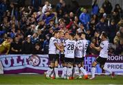 30 September 2022; Dundalk players celebrate their side's second goal, an own goal scored by Dane Massey of Drogheda United, not pictured, during the SSE Airtricity League Premier Division match between Dundalk and Drogheda United at Casey's Field in Dundalk, Louth. Photo by Ben McShane/Sportsfile