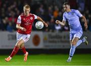 30 September 2022; Tom Grivosti of St Patrick's Athletic in action against Ryan Graydon of Derry City during the SSE Airtricity League Premier Division match between St Patrick's Athletic and Derry City at Richmond Park in Dublin. Photo by Eóin Noonan/Sportsfile
