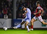 30 September 2022; Cian Kavanagh of Derry City shoots to score his side's first goal, as Joe Redmond of St Patrick's Athletic looks on, during the SSE Airtricity League Premier Division match between St Patrick's Athletic and Derry City at Richmond Park in Dublin. Photo by Eóin Noonan/Sportsfile