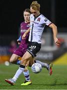 30 September 2022; Greg Sloggett of Dundalk in action against Darragh Markey of Drogheda United during the SSE Airtricity League Premier Division match between Dundalk and Drogheda United at Casey's Field in Dundalk, Louth. Photo by Ben McShane/Sportsfile