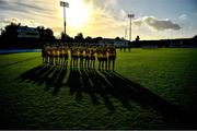 1 October 2022; Na Fianna players stand for a minutes silence in memory of the late Brian Mullins before the Dublin County Senior Club Football Championship Semi-Final match between Ballyboden St Endas and Na Fianna at Parnell Park in Dublin. Photo by Eóin Noonan/Sportsfile