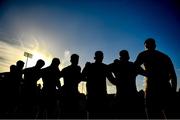 1 October 2022; Na Fianna players stand for a minutes silence in memory of the late Brian Mullins before the Dublin County Senior Club Football Championship Semi-Final match between Ballyboden St Endas and Na Fianna at Parnell Park in Dublin. Photo by Eóin Noonan/Sportsfile