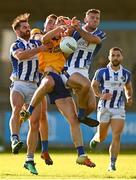 1 October 2022; Michael Day of Na Fianna in action against Michael Darragh Macauley, left, and Luke Donoghue of Ballyboden St Enda's during the Dublin County Senior Club Football Championship Semi-Final match between Ballyboden St Endas and Na Fianna at Parnell Park in Dublin. Photo by Eóin Noonan/Sportsfile