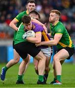2 October 2022; Dara Mullin of Kilmacud Crokes is tackled by Cian Murphy, left, and Seán Farrell of Thomas Davis during the Dublin County Senior Club Football Championship Semi-Final match between Thomas Davis and Kilmacud Crokes at Parnell Park in Dublin. Photo by Eóin Noonan/Sportsfile