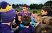 2 October 2022; Shane Walsh of Kilmacud Crokes signs autographs for supporters after the Dublin County Senior Club Football Championship Semi-Final match between Thomas Davis and Kilmacud Crokes at Parnell Park in Dublin. Photo by Eóin Noonan/Sportsfile