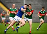 2 October 2022; Mark McCarvelle of Scotstown in action against Ciaran McNulty of Inniskeen during the Monaghan County Senior Club Football Championship Semi-Final match between Inniskeen and Scotstown at St Tiernach's Park in Clones, Monaghan. Photo by Philip Fitzpatrick/Sportsfile