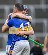 2 October 2022; Stephen Maher of Clough/Ballacolla celebrates with teammate Willie Hyland, 17, after their side's victory in the Laois County Senior Hurling Championship Final match between Clough/Ballacolla and Camross at MW Hire O'Moore Park in Portlaoise, Laois. Photo by Piaras Ó Mídheach/Sportsfile