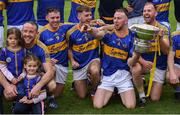 2 October 2022; Clough/Ballacolla players, including Eoin Doyle, 4, and Seán Corby, celebrate with the cup after their victory in the Laois County Senior Hurling Championship Final match between Clough/Ballacolla and Camross at MW Hire O'Moore Park in Portlaoise, Laois. Photo by Piaras Ó Mídheach/Sportsfile