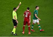 27 September 2022; Jayson Molumby of Republic of Ireland, right, is shown an yellow card by referee Rade Obrenovic during UEFA Nations League B Group 1 match between Republic of Ireland and Armenia at Aviva Stadium in Dublin. Photo by Sam Barnes/Sportsfile