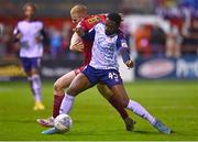 3 October 2022; Tunde Owolabi of St Patrick's Athletic in action against Gavin Molloy of Shelbourne during the SSE Airtricity League Premier Division match between Shelbourne and St Patrick's Athletic at Tolka Park in Dublin. Photo by Ben McShane/Sportsfile