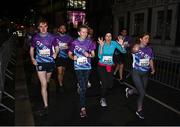4 October 2022; Participants, from left, Diarmuid Cahill of The Ferrymen, Lorraine Bissett of Bkackrock Bombers, Jane Collins of Risk Runners and Kerrie Fox of Travel Department - 2, compete in the Grant Thornton Corporate 5K Challenge at Dublin Docklands in Dublin. Photo by Eóin Noonan/Sportsfile