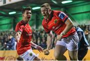 7 October 2022; Patrick Campbell of Munster celebrates with teammate Joey Carbery, left, after scoring their side's first try during the United Rugby Championship match between Connacht and Munster at The Sportsground in Galway. Photo by Brendan Moran/Sportsfile