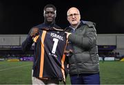 7 October 2022; Irish athlete and 100 metre national record holder Israel Olatunde is presented with a Dundalk jersey by Dundalk chief operating officer Martin Connolly during half-time of the SSE Airtricity League Premier Division match between Dundalk and St Patrick's Athletic at Casey's Field in Dundalk, Louth. Photo by Seb Daly/Sportsfile